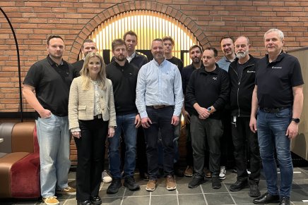 Gruppebilde av ansatte i GK og Statsbygg på oppstilt på USN.